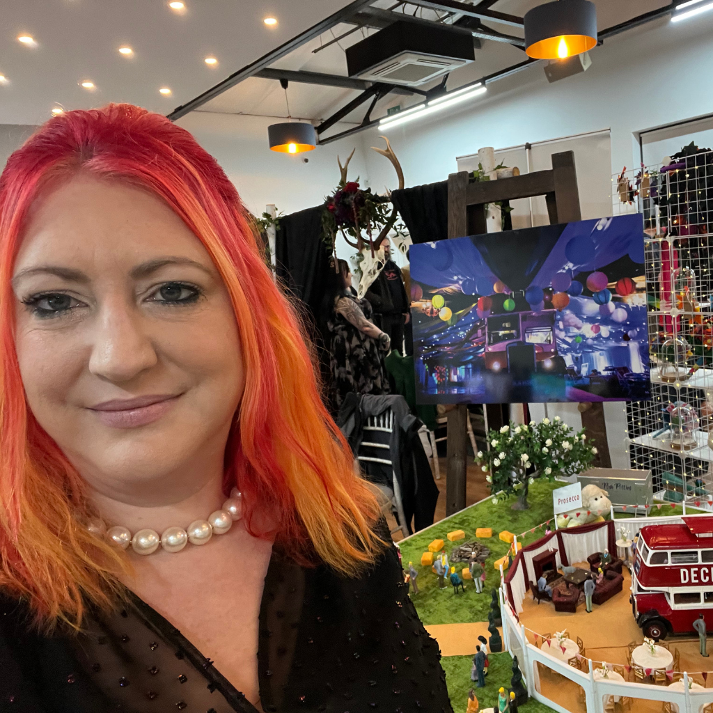 Clare with Deckerdence wedding venue model in the background